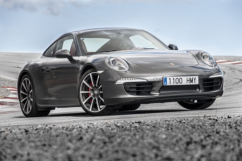 A modern Porsche 911 on the road